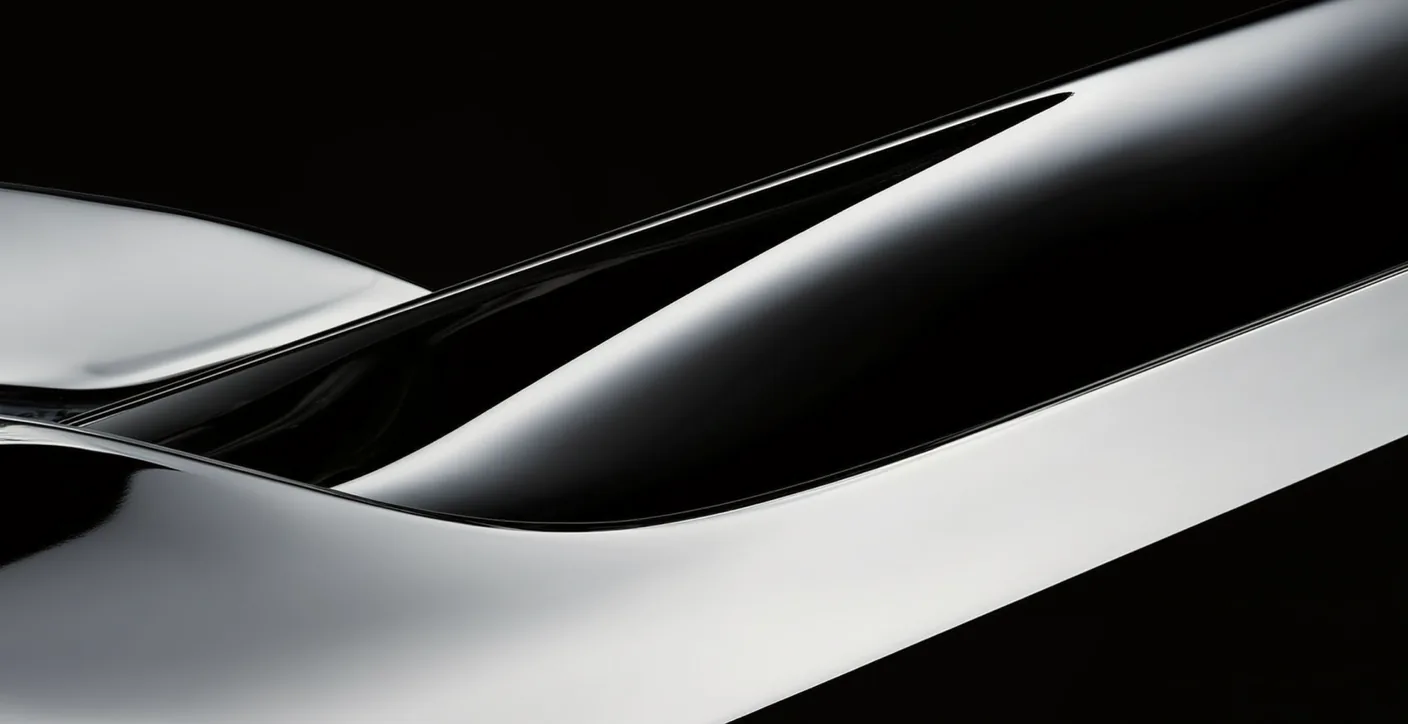A sweeping chromed metal form on black