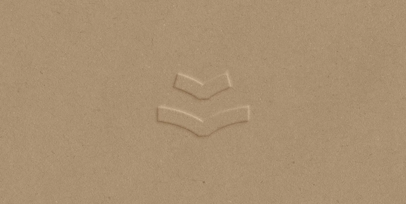 Sage logomark blind-embossed on a craft-paper surface