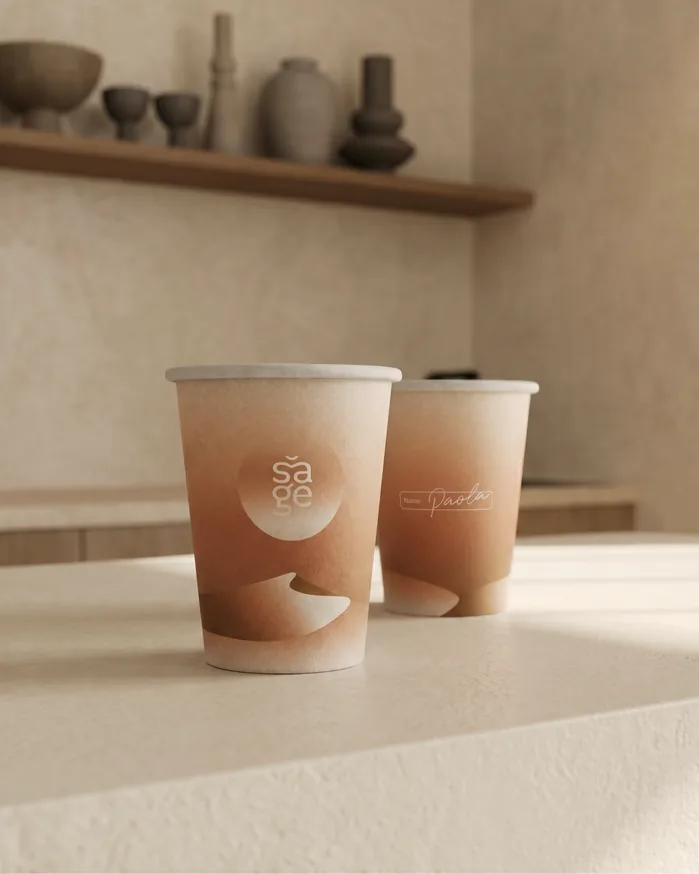 Sage branded takeaway cups on a counter